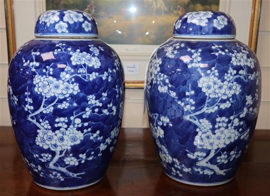 A pair of Chinese blue and white jars and covers, c.1900, Kangxi mark (one a.f.)